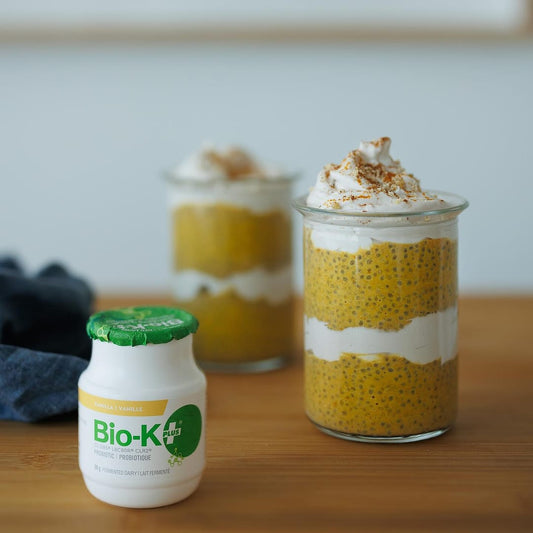 Bio-K+ Vanilla fermented probiotic next to pumpkin spice chia seed pudding parfait recipe.