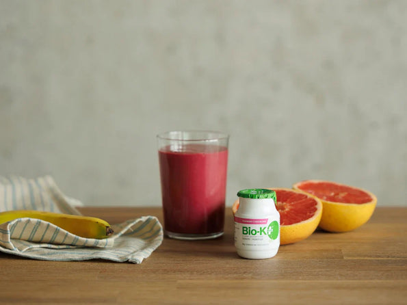 Beet, grapefruit, and raspberry probiotic smoothie made with Bio-K+ drinkable for gut and vaginal microbiome health.