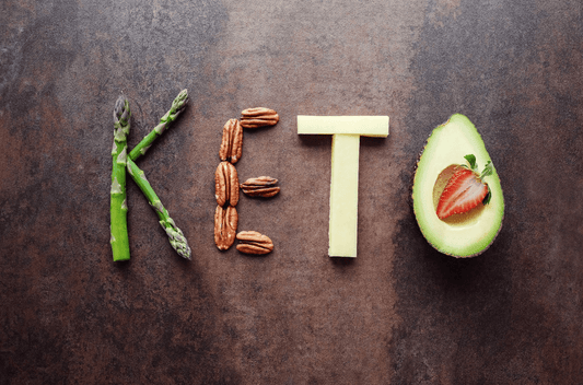 The word KETO written with nuts and veggies